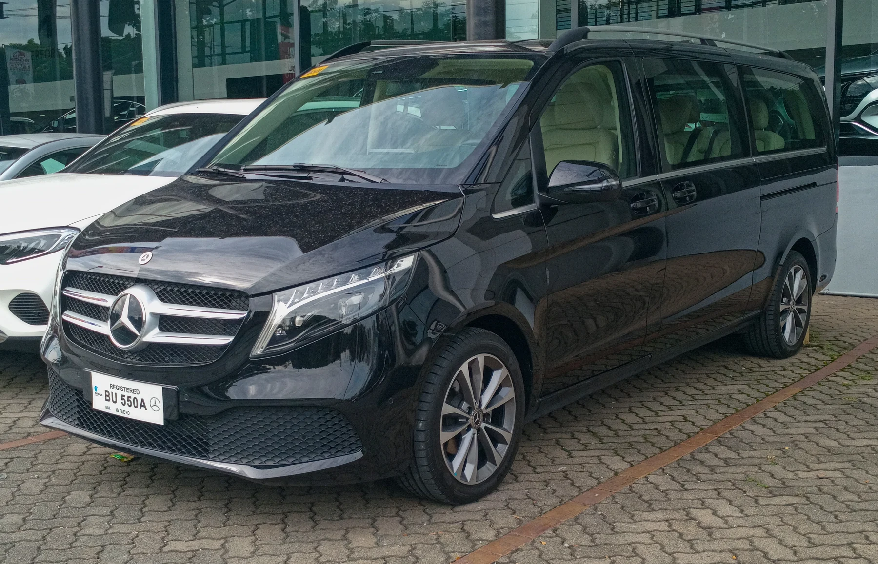 Real photograph of a black Mercedes-Benz V-Class at a dealership
